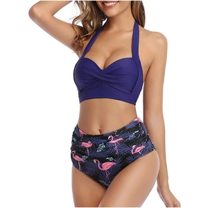 Detail of high waisted bikini bottoms with pink flamingo and tropical leaf print