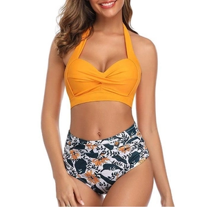 Ginger yellow twist-front halter bikini top with high-waisted floral print bottoms