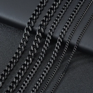 Multiple widths of stainless steel Cuban link necklaces shown in parallel on a dark surface