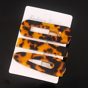 Detail shot of the tortoise shell acetate hair clip set showing unique patterns and textures.