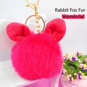 Watermelon red plush bunny ear keychain in rabbit and fox fur with golden metal ring