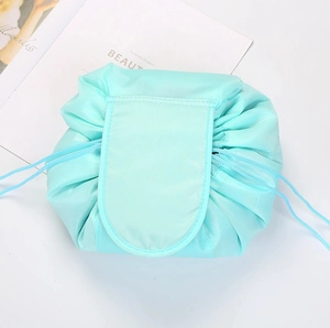 Detailed view of the light blue portable drawstring makeup bag, perfect for travel and daily storage.
