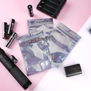 Three silver anti-static ziplock bags for electronic gadgets on a dual-tone background