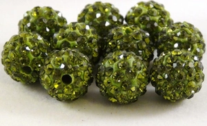 Macro shot of olive green disco ball rhinestone beads with double holes for jewelry making