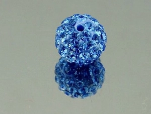 Macro shot of 10mm blue Shamballa disco ball clay bead with crystal pavé and center hole