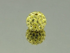 Macro view of a 10mm yellow Shamballa pave clay bead with glass rhinestones and reflection