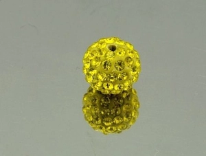 Detail of 10mm yellow Shamballa bead with pavé crystals and straight hole for DIY jewelry