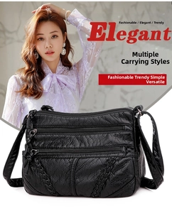 Close-up of black multi-zippered crossbody bag with woven details and adjustable strap