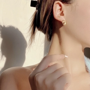 Elegant gold irregular twisted geometric earrings with minimalist aesthetic for women