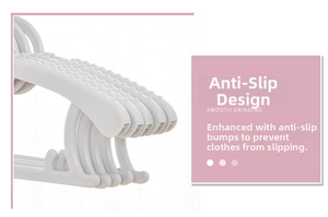 Detail of adjustable plastic baby hanger with non-slip bumps for secure drying and grip