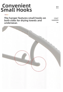 Detail view of white plastic hanger with non-slip ridges and small utility hooks