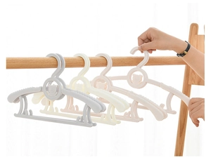 Close-up of adjustable plastic children's hangers in pastel colors with anti-slip design