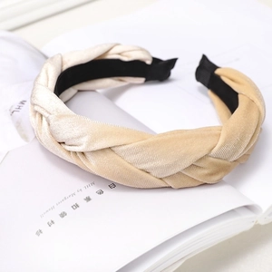 Detail view of khaki velvet braided headband with a soft texture and non-slip lining