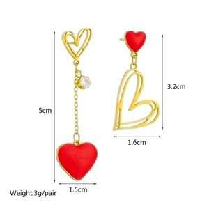 Asymmetrical red heart tassel earrings in gold stainless steel with zircon detail