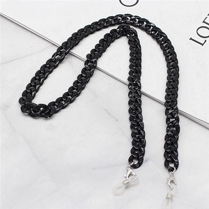 Chunky black acrylic glasses chain and mask lanyard with silver lobster clasps on marble