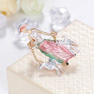 Elegant enamel brooch featuring a woman walking dogs with vibrant gold finish jewelry piece