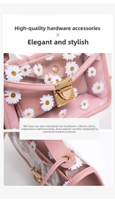 Detail of pink daisy floral bag featuring a gold metal clasp and reinforced ring buckles