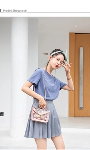 Pink transparent jelly shoulder bag with white daisy prints and gold metal lock detail