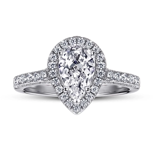 Close-up of pear-cut moissanite ring in 925 sterling silver with halo setting