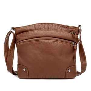 Brown soft PU leather crossbody bag with multiple zipper compartments on white background