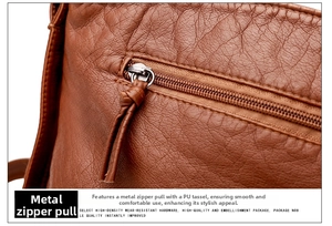 Détail du curseur de fermeture éclair en métal et du cuir PU grainé marron du sac