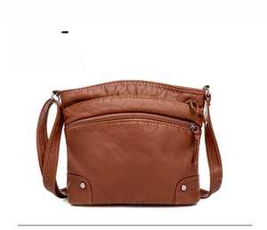 Front view of brown washed PU leather crossbody bag featuring multi-layer zip pockets