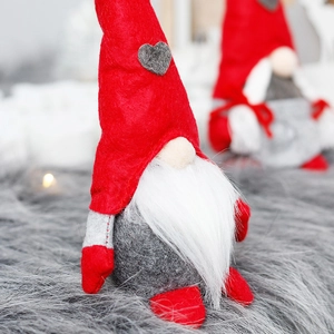 Standing Christmas gnome with red heart hat, white beard, and cozy plush material