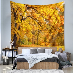 Close-up of bohemian autumn forest tapestry with golden maple leaves for wall decor