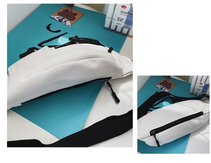 Detailansicht der hochwertigen Canvas-Stofftextur und des Reißverschlusses der weißen Tasche