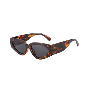 Tortoiseshell cat-eye sunglasses with dark grey lenses in a retro fashion style