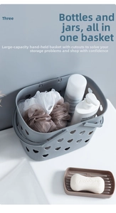 Detail view of a gray heart-shaped cutout shower basket with bath accessories