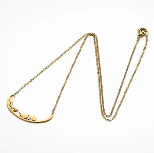 Minimalist gold stainless steel necklace featuring a bird on branch hollow pendant design