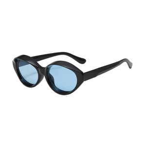 Retro cat-eye sunglasses with thick black frame and transparent blue lenses for women