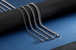 Detailed comparison of four silver stainless steel chain necklaces in various thicknesses