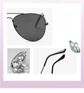 Close-up of black metal aviator sunglasses with classic double bridge and dark lenses