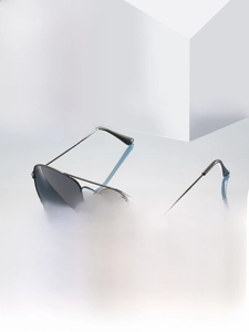 Detail view of black aviator sunglasses with polarized lenses and metal frames