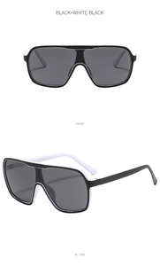 Front and side view of black and white oversized aviator sunglasses with dark grey lenses