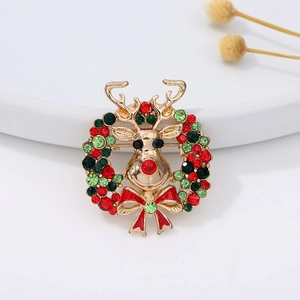 Christmas reindeer wreath brooch with red and green rhinestones on gold base
