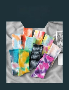 Detailed view of ten colorful tie-dye cotton crew socks with soft ribbed texture