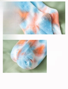 Detailed view of tie-dye crew socks featuring reinforced 3D heel and smooth toe seam