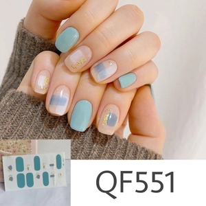 Detail view of mint green and nude nail stickers with blue accents and gold glitter QF551