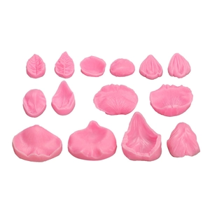 Macro detail of 12-piece pink silicone molds for fondant flower petals and leaf textures