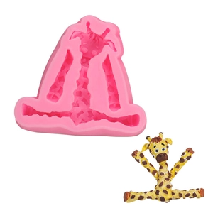Detailed view of pink silicone giraffe mold with 3D animal fondant cake decoration
