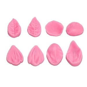 Close-up of pink silicone fondant molds showing detailed leaf and petal vein textures
