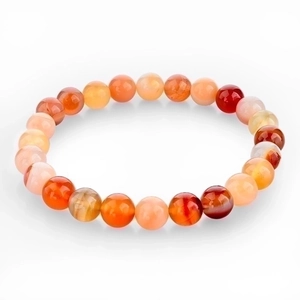 Macro shot of striped agate beaded bracelets in orange, red, and yellow with natural texture