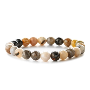 Natural zebra stone beaded bracelet with earth-toned mineral beads on white background