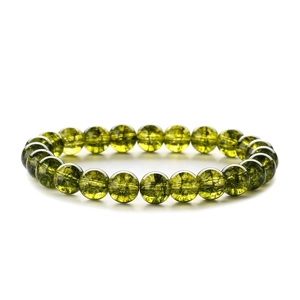 Macro shot of green agate beaded bracelet showing translucent texture and glossy round beads