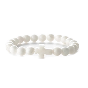 Detail of white turquoise beaded bracelet featuring a smooth polished cross charm detail