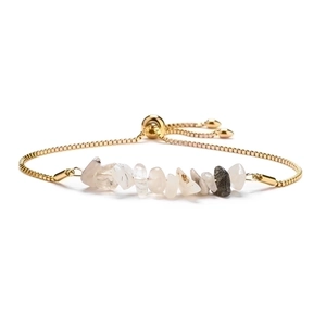 Detail of adjustable gold slider bracelet with natural crystal crushed stone beads