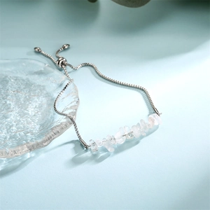 Detail of adjustable stainless steel chain bracelet with natural clear crystal stones